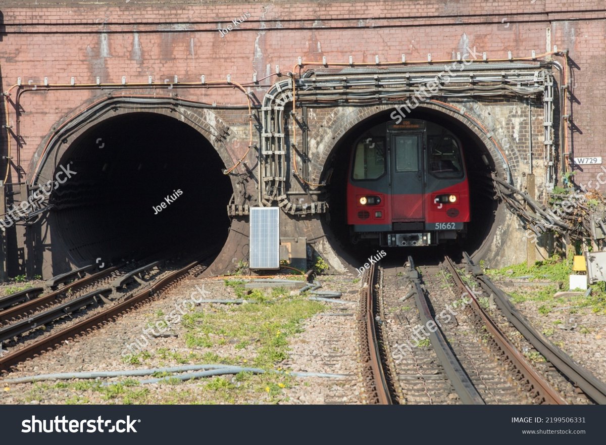 London, UK. October 10th, 2018. London underground tunnels with one train in the entrance and exit coming overground. shutterstock.com/image-photo/lo… #londonunderground #londontube #traintunnels #tubetrain #londontransport #transport #uk #travel #londontourism