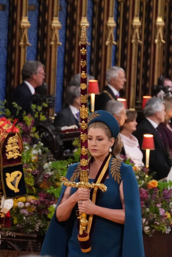 thiliel's tweet photo. Strange women distributing swords is no basis for a system of government. But the outfit is fire ⚔️ #Coronation https://t.co/DDZQBXELRg