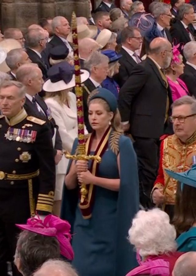 Sozzinski's tweet image. Just a reminder this is @PennyMordaunt the woman who insulted Andrew Bridgen and has completely disregarded the vaccine injured and dead in the UK. Not surprising she's carrying a sword for the head of the Royal dept of the WEF. Ghastly woman.