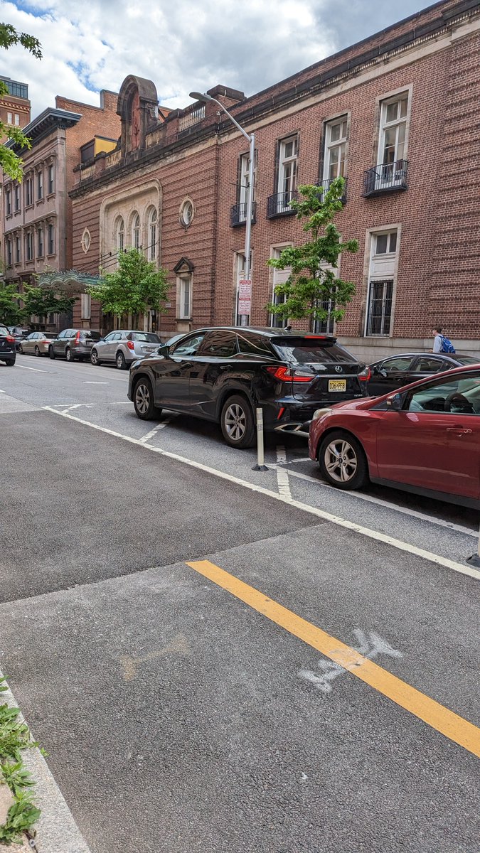 This Lexus owner said that they could park here 'because I always park here'. When it was pointed out that they are blocking sightlines, illegal parking bingo started:
* We're just unloading
* We're not staying
* We have a baby in the car
* It's illegal to take pictures of my car