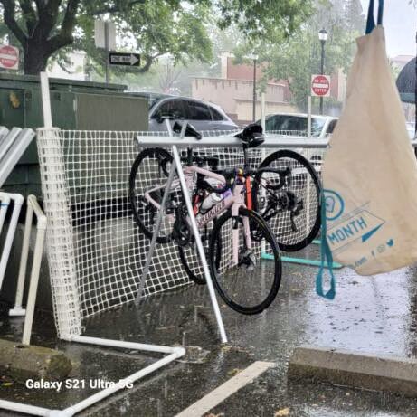 mayisbikemonth's tweet photo. The rain came, but so did cyclists. @sacbike bike valet is ready for to park bikes for attendees at the @californiahoneyfestival ! Don't forget to stop by our tent for a chance at some swag! https://t.co/NMvhUaKKJr