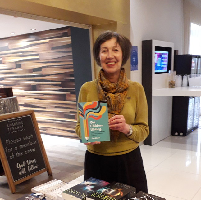 Stevensonauthor's tweet photo. #Author SueWalsh with her book Get Children Writing at the #Warwickshire authors stand of the Stratford Literary Festival. Last day tomorrow - don't miss out on your chance to visit the festival and attend some great events! @StratLitFest https://t.co/5NUs1pDmr7