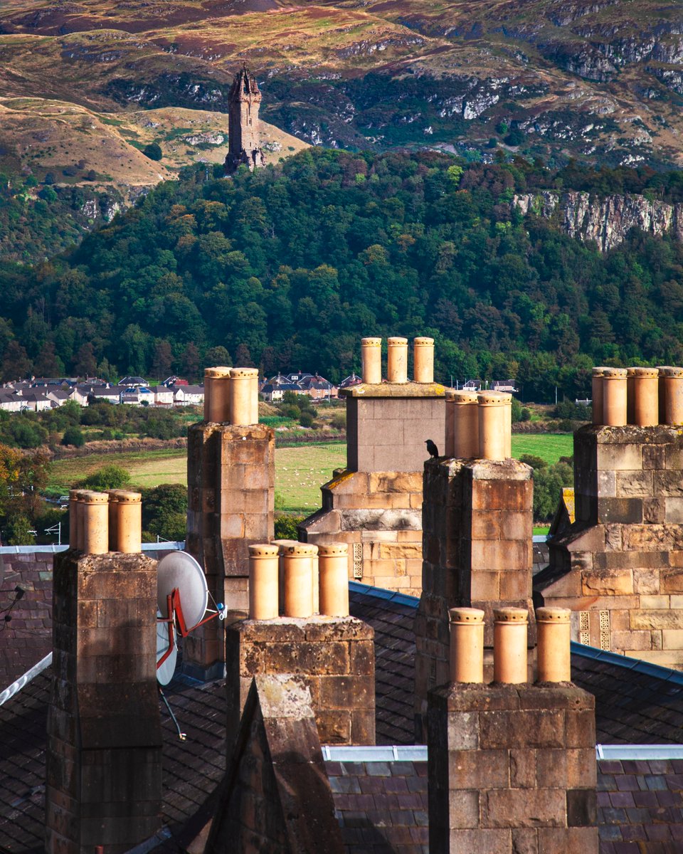 Across the rooftops and chimneys of Stirling looking towards the Wallace Monument standing above the site of the 1297 Battle of Stirling Bridge #williamwallace #stirling #ScottishHistory #History #scotland #travelphotography #scottish