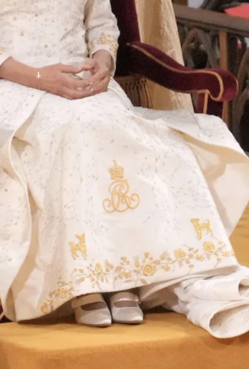 The most British thing ever. HM The Queens dogs, Bluebell and Beth on her #Coronation robe.