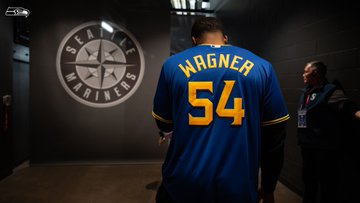 Bobby Wagner throws the first pitch at the Mariners game.