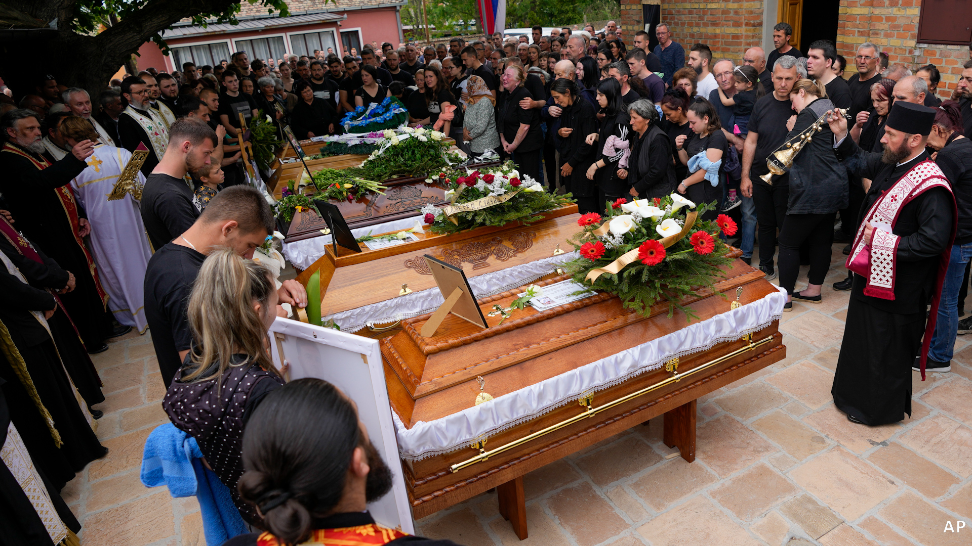 Burials held in Serbia for some victims of mass shootings