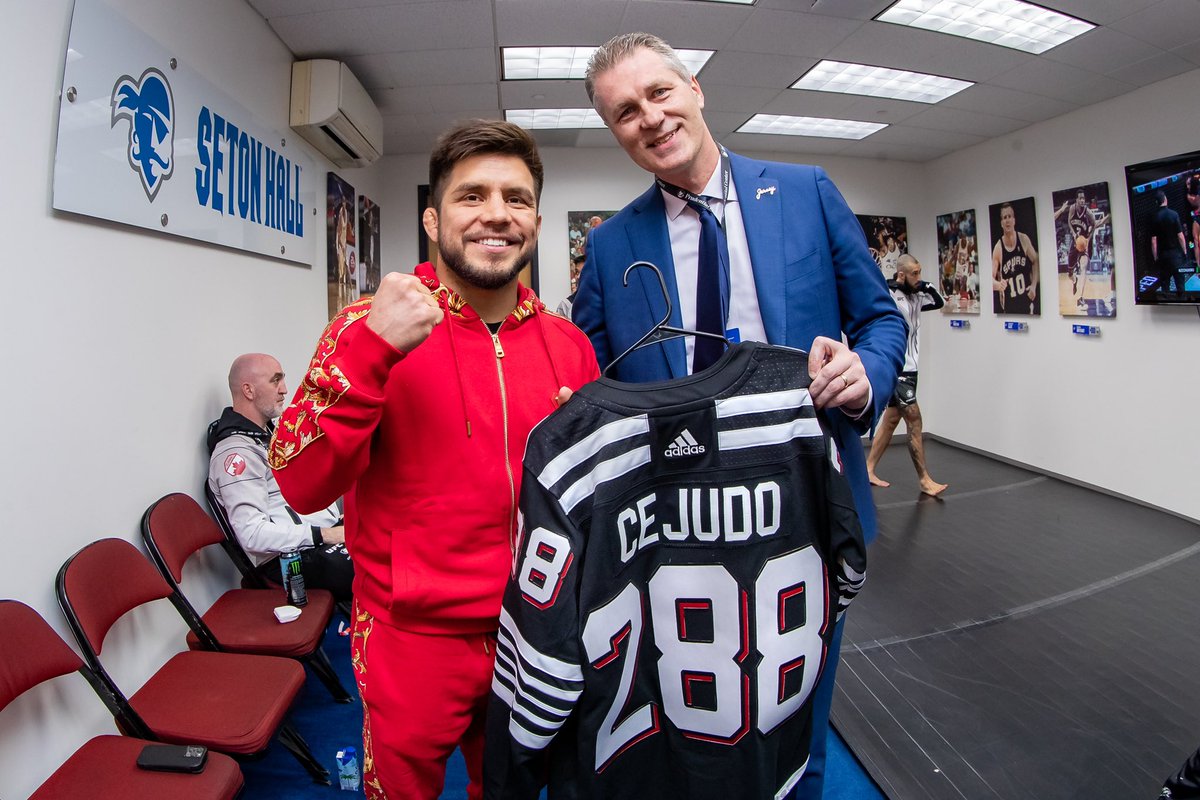 PruCenter's tweet photo. When two worlds collide! #UFC288 

@NJDevils 🤝 @ufc https://t.co/3XQip7ZyKY