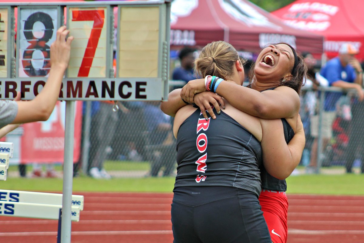 Clinton's Meagan Womack broke a 25-year-old Mississippi state high school record in the shot put on Saturday, with a throw of 45 feet, 4.5 inches. Clinton won the MHSAA Class 6A girls' team championship as well.