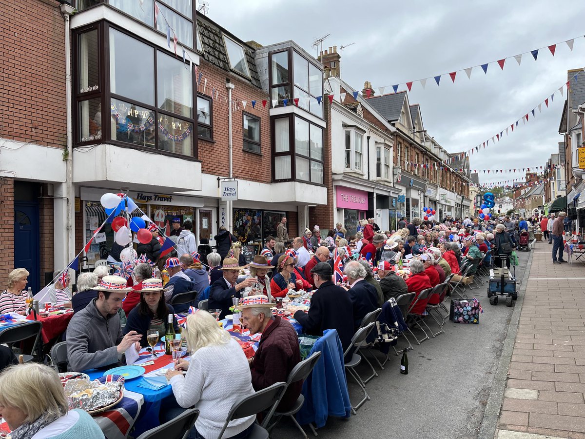 Coronation Street Party in Budleigh High Street this afternoon. Some 110 tables occupied by locals and their guests. Wonderful. Community party and heartfelt thanks to all the team of volunteers at our Information Centre.