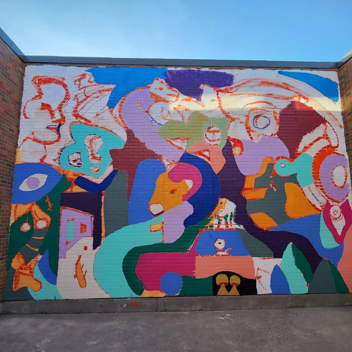BCHSChargers's tweet photo. Muralist Scott Clark is working with our Art students to convert a blank wall into a beautiful piece of art! The students helped with the design
and will learn aspects of mural art in completing the piece. It’s coming to life! 
#chargerpride #rvsed https://t.co/CaMqDcgWHO