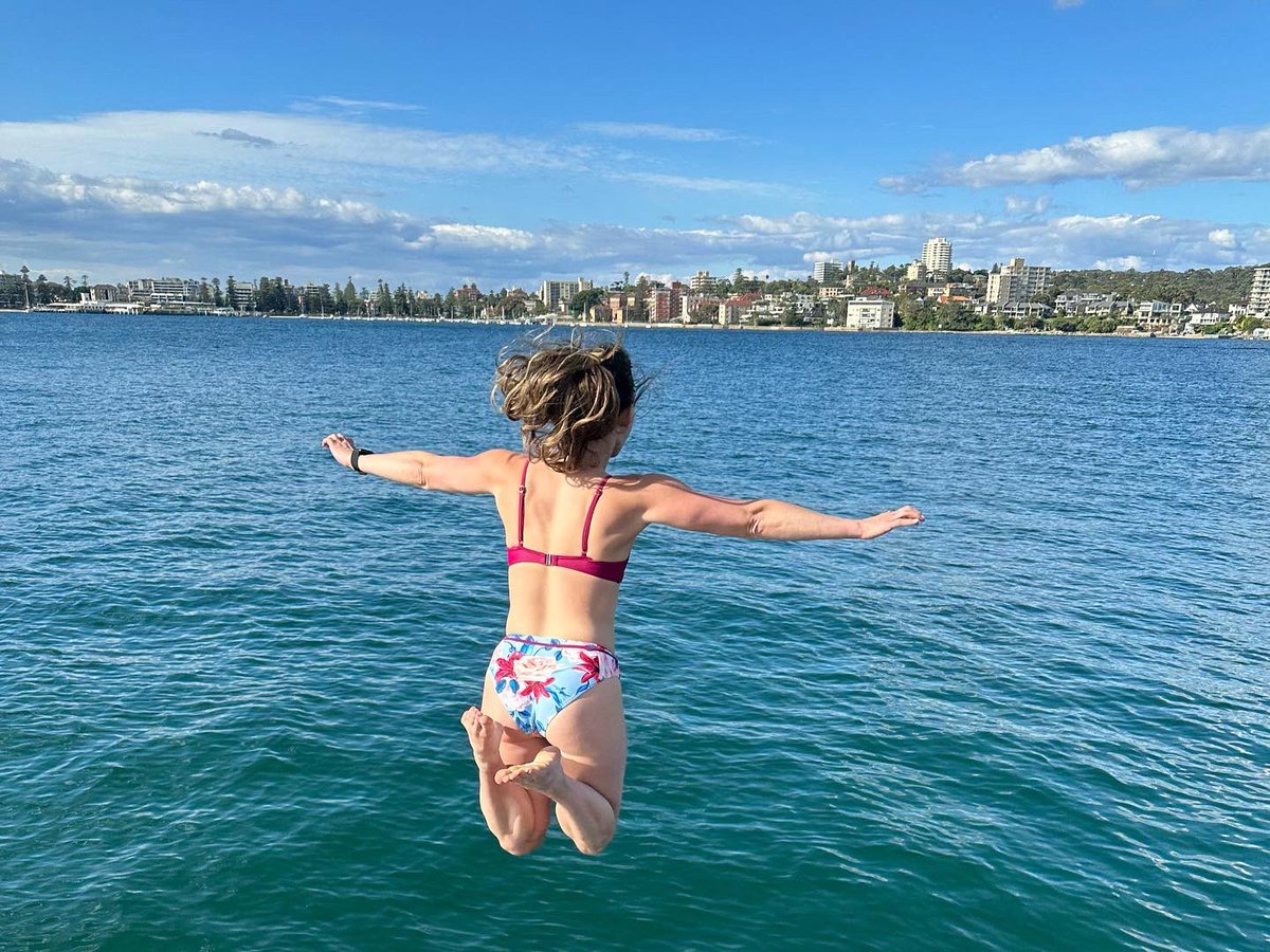 Sarahellenbraun's tweet photo. Jumping into Monday like:

When I returned from Sydney my husband saw this picture of me and was inconsolable “you SWAM in the Sydney harbor?!? But there are great whites in there!” 🤷🏻‍♀️ https://t.co/Z3OzuRyAqO