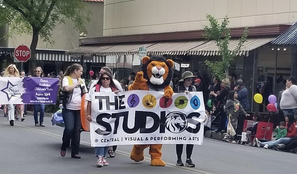 The Studios @ Central participating in the Kiwanis club Kiddie Parade. Summer at the Lake was the theme this year for The Studios.