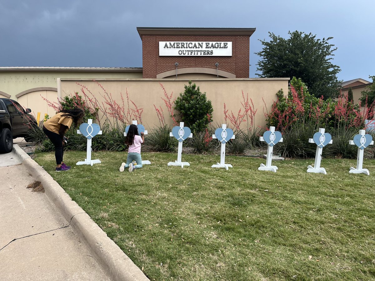 Scaia's tweet photo. A woman outside Allen Premium Outlets says she’s glad to see so many adding to the memorial. She says this represents who we really are. “It’s wonderful, but this is what I would expect, though.” https://t.co/9Z2f4B7ycz