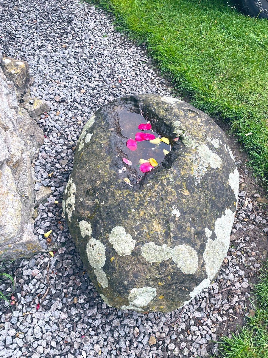 The Omphalos Stone with ritual offerings #GlastonburyAbbey #OmphalosStone #Goddess #Ritual #MonumentMonday