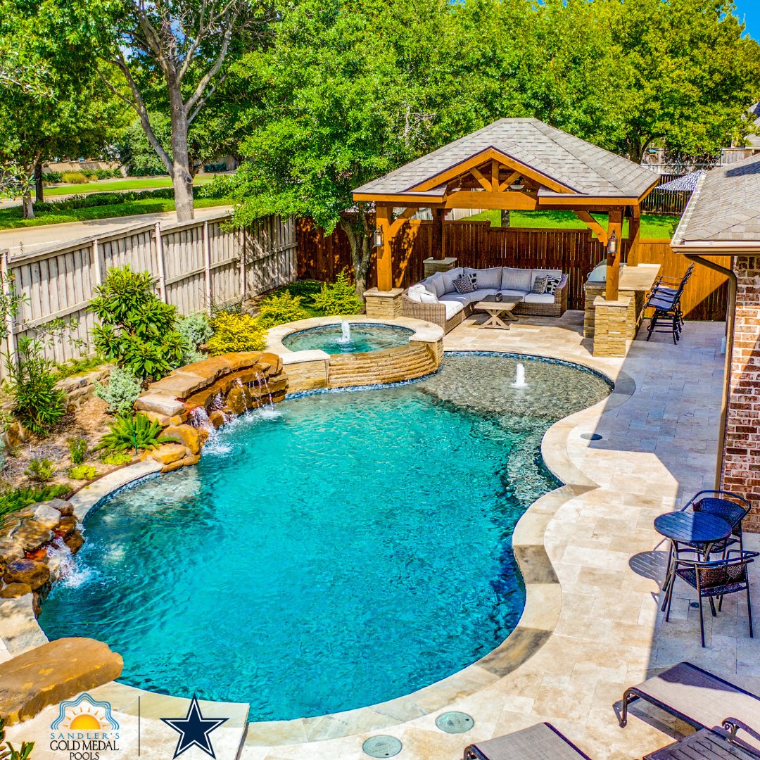 Escape the ordinary with a freeform pool design from Gold Medal Pools. Our expert designers can create a custom shape that perfectly complements your backyard and adds a unique touch of elegance to your outdoor space.