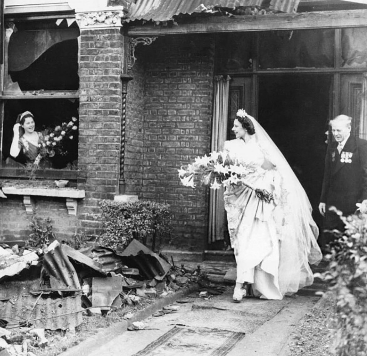 Bride leaving her recently bombed home to get married, London, Nov 4, 1940.