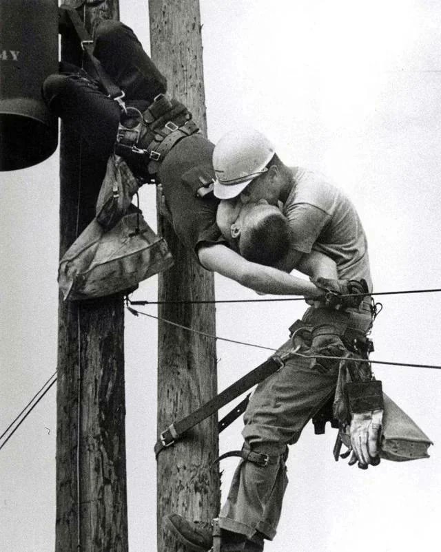 The Kiss of Life - A utility worker giving mouth-to-mouth to a co-worker after he contacted a low voltage wire in Jacksonville, Florida, 1967.