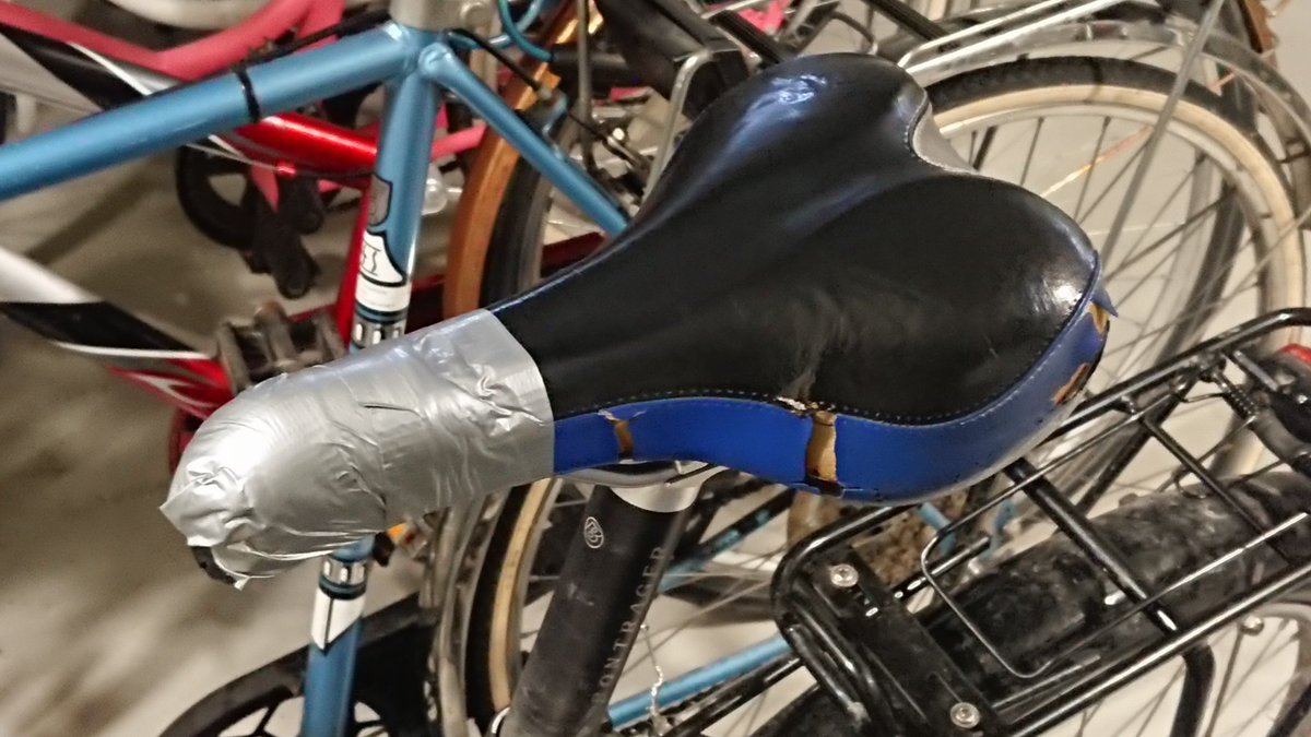 soodagyver's tweet photo. Saddle been dying for years, now the front fell off. Almost declared it's time to get a new one for this disaster of a bike, but invested an old rolled up sock and some duct tape. Perfect for at least another year. Also great theft protection: any other bike looks more desirable. https://t.co/FKOUUASscu