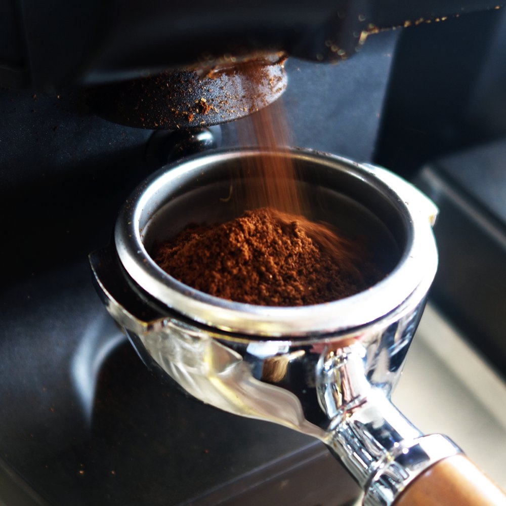Coffee DO's and DON'Ts: Engage the grinder while adjusting to a finer grind to remove any beans between the burrs by grinding rather than crushing. 

This will help relieve any resistance to the adjustment and incur less stress on the grinder mechanism.