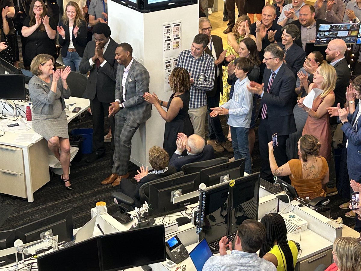 The ⁦<a href="/washingtonpost/">The Washington Post</a>⁩ celebrates three Pulitzers, with winners Toluse Olorunnipa and Robert Samuels (left of pillar), Eli Saslow (checked shirt) and Caroline Kitchener (brown dress), applauded by Executive Editor Sally Buzbee.