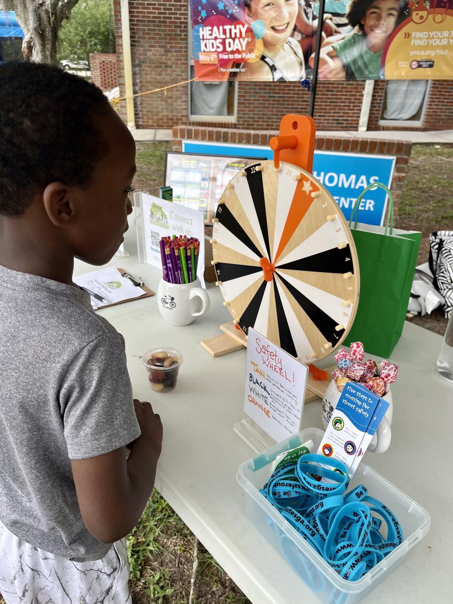 BikeWalkGolden's tweet photo. We have some young safety experts in the making! BWGI joined with @GASafeRoutes  for #healthykidsday at @YMCAofCoastalGA , complete with a “crosswalk” with "traffic" for kids to show how to be safe when on the go. https://t.co/2f8Cfsj8xJ