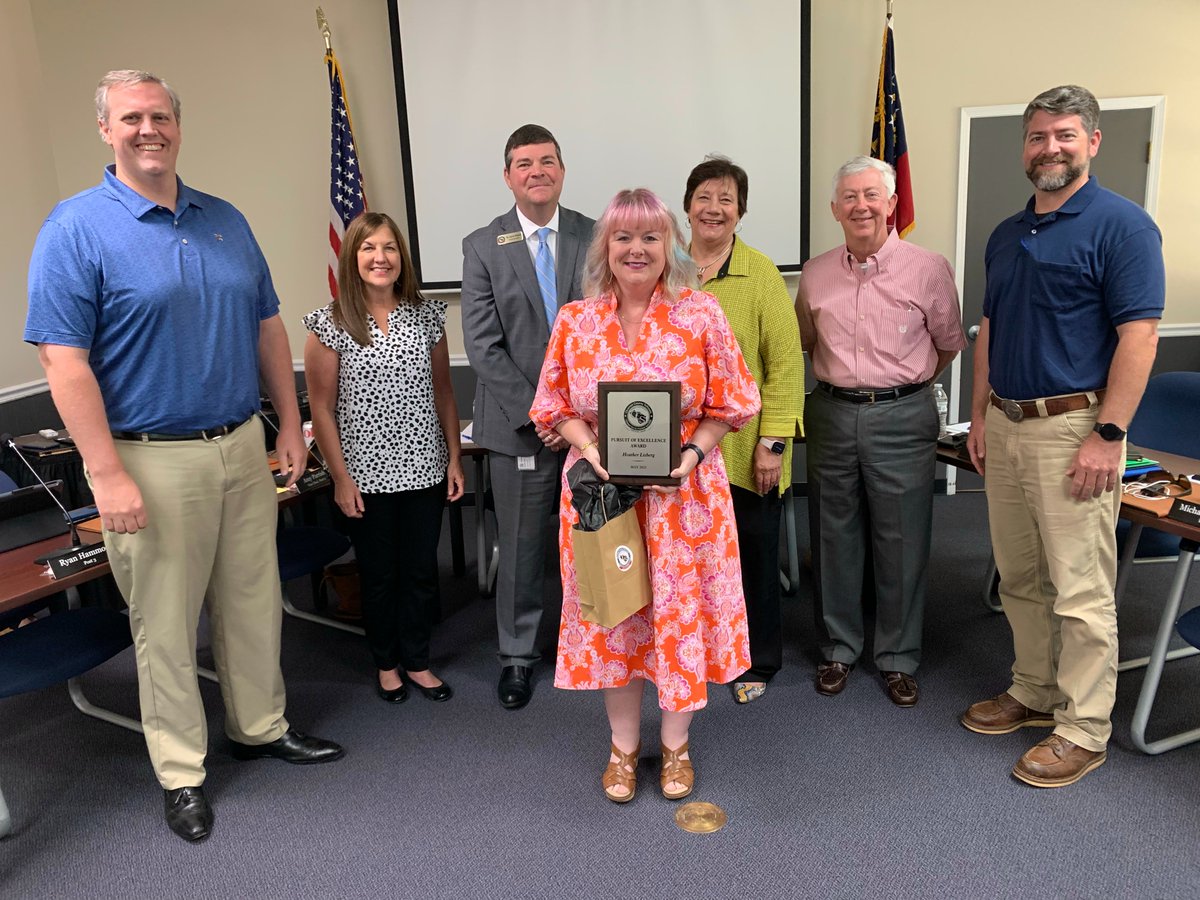 OconeeCoSchools's tweet photo. The Board recognized Oconee Elementary clerk Heather Lisberg as the winner of the May Pursuit of Excellence Award. She received a $50 VISA gift card and a coffee mug from Peach State Federal Credit Union, a $50 gift card from Chops and Hops, and a commemorative plaque from OCS. https://t.co/ELfp8LKB2Q