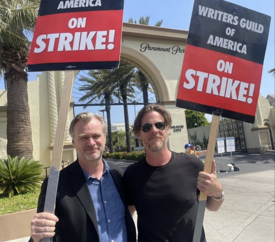 DiscussingFilm's tweet photo. Christopher Nolan and Jonathan Nolan on the picket line for the writers strike outside Paramount Pictures. https://t.co/oD9RElmewR