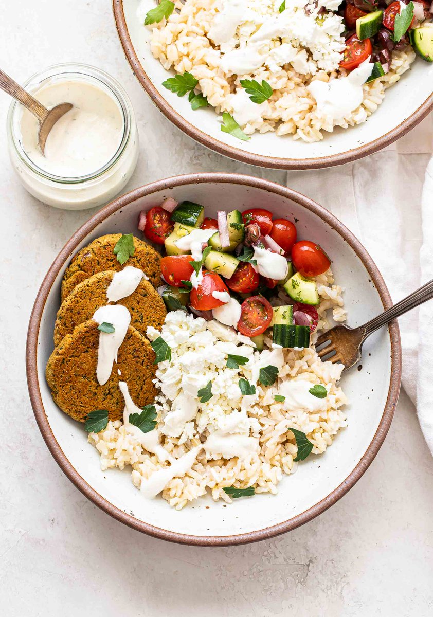 RecipeRunner's tweet image. #AD Mediterranean #falafel bowls are topped with homemade baked falafels, a tomato cucumber salad, feta, and an incredible creamy #tahini #yogurt dressing. Balanced, healthy and great for #mealprep! reciperunner.com/falafel-bowls/…