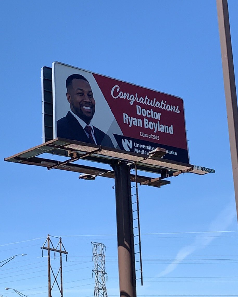 AmerMedicalAssn's tweet photo. When you love your #medschoolgrad so much you need to share it with the world, or at least with the highway 😂 Congratulations to @RyanBoyland &amp; the #Classof2023! We can't WAIT to cheer you on in your medical career. #MedStudentTribute https://t.co/qjDDCRTyy9