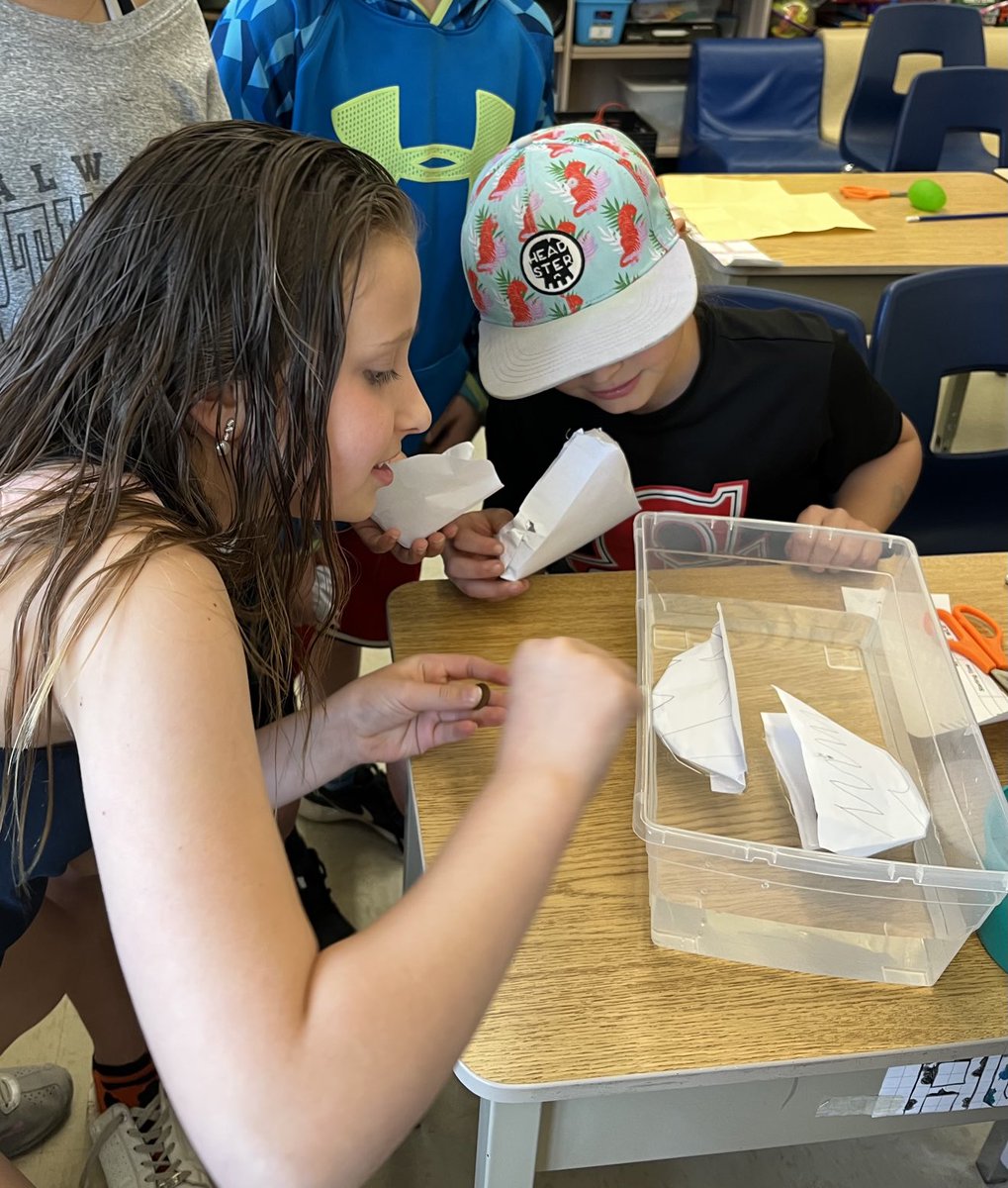 AvonHahn's tweet photo. Engineers at work exploring buoyancy - the paper boat challenge. Tomorrow we will have round 2 and see if students can make changes and create a boat that will hold more weight. https://t.co/B7XFM6I7pU