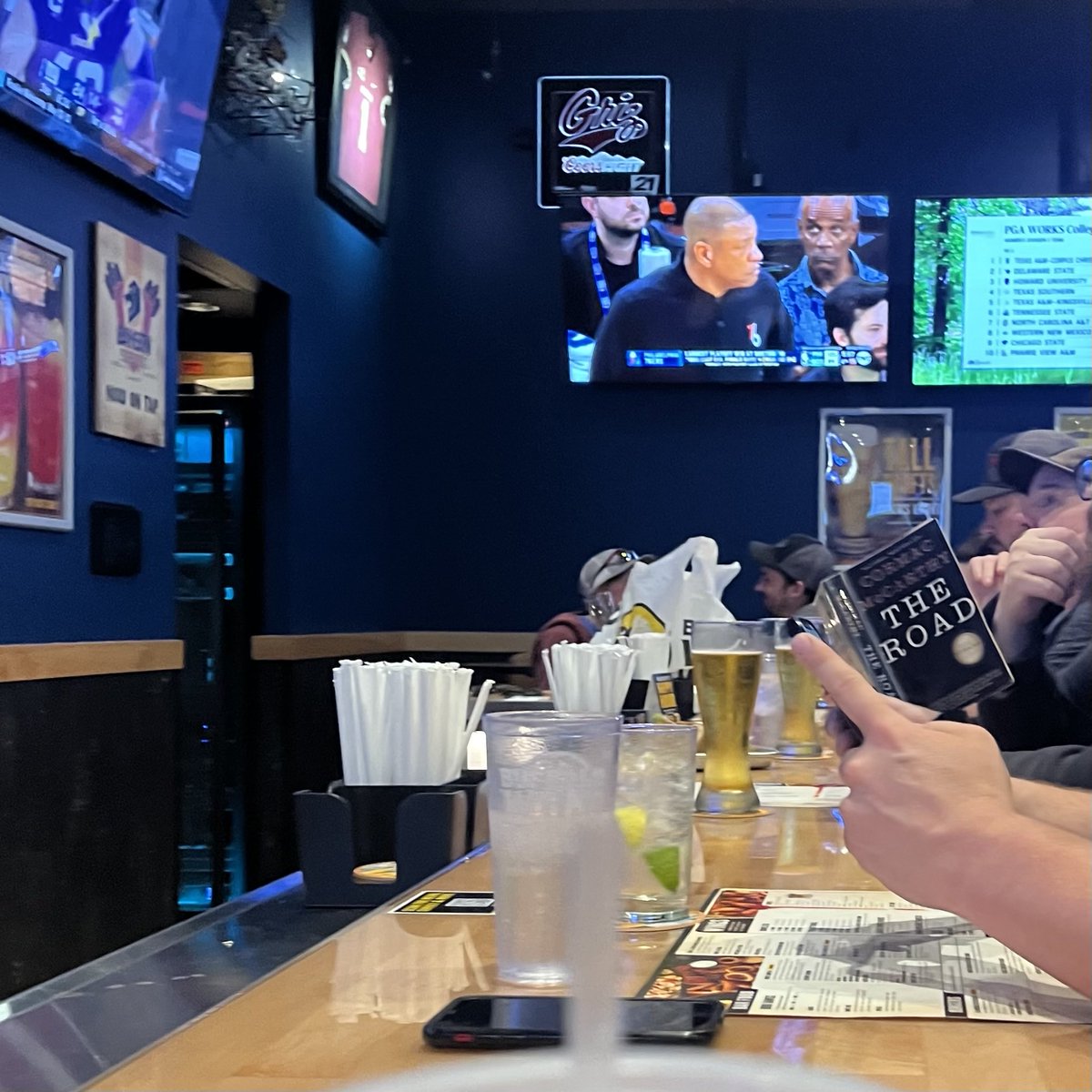 chaddundas's tweet photo. A picture a friend sent me of a guy reading The Road at Buffalo Wild Wings https://t.co/X2uqB5tMZQ