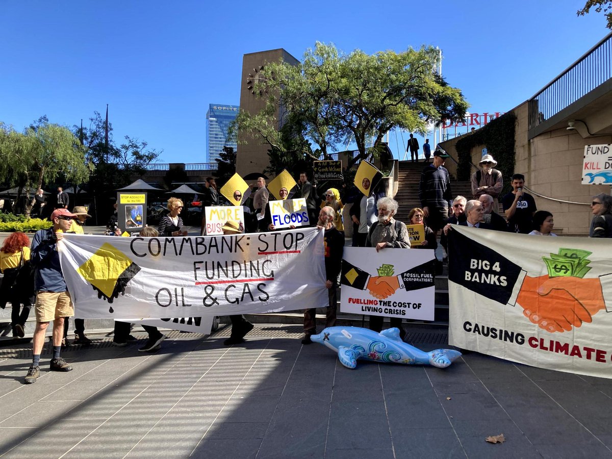 350Australia's tweet photo. These Sydney activists turned up the sass on @CommBank today with dead dolphins (thanks Santos), a copy of Greta's book and a clear call to action: #BreakUpWithGas
#BankOnOurFuture https://t.co/EyMvX9ddEr