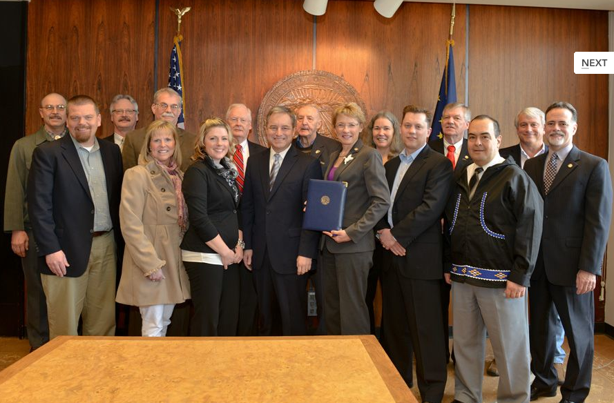 AlaskaMiners's tweet photo. It's Alaska Mining Day!  Please enjoy this photo from when the bill was signed in 2013.  Holding the bill is the sponsor, Senator Cathy Giessel, who remains a champion to our industry 11 years later!  #akminingday2023 https://t.co/K8yxH33rg1