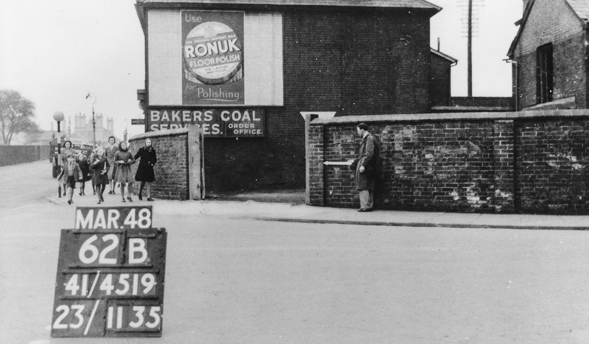 In 1948 Bakers Coal Yard was at the junction of Romsey Road with Station Hill (to the left). Above the group of people can be seen the chimneys of the long-since demolished Junction Hotel, now used as the station car park.