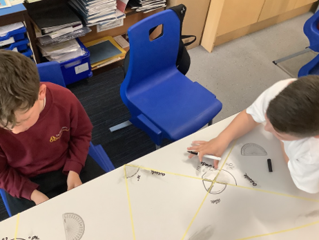 DTPartington's tweet photo. In Maths, Year 5 have been using protractors to measure angles. #handsonlearning #maths https://t.co/CTPs48JSko