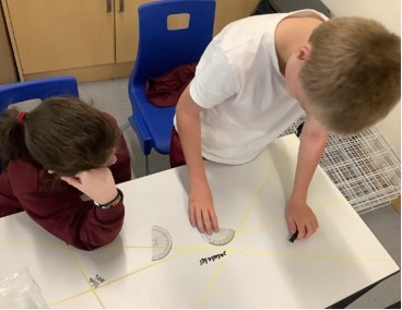 DTPartington's tweet photo. In Maths, Year 5 have been using protractors to measure angles. #handsonlearning #maths https://t.co/CTPs48JSko