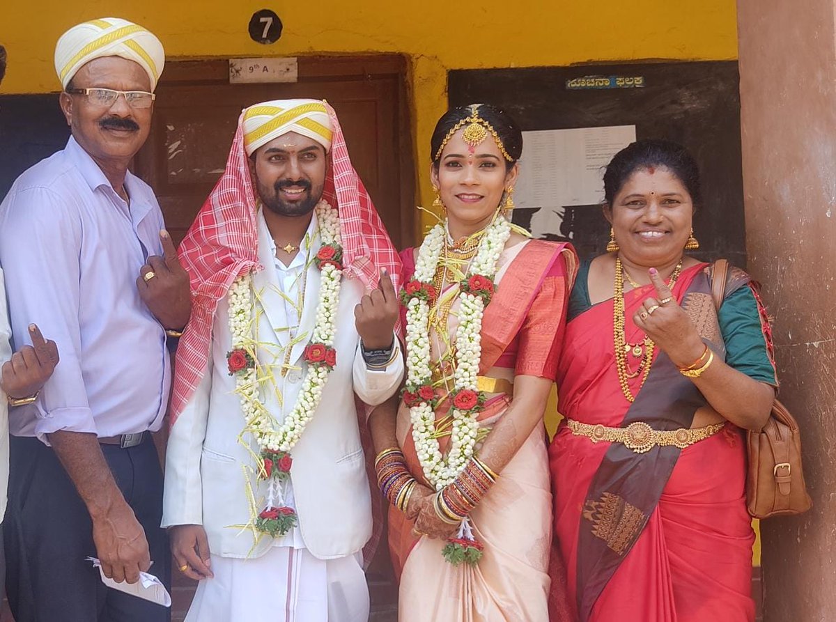 #Bride and #groom along with their family cast their votes at a  polling  booth in Mysuru for #KarnatakaElections. 

#Karnataka #KarnatakaVotes #KarnatakaAssemblyElection2023