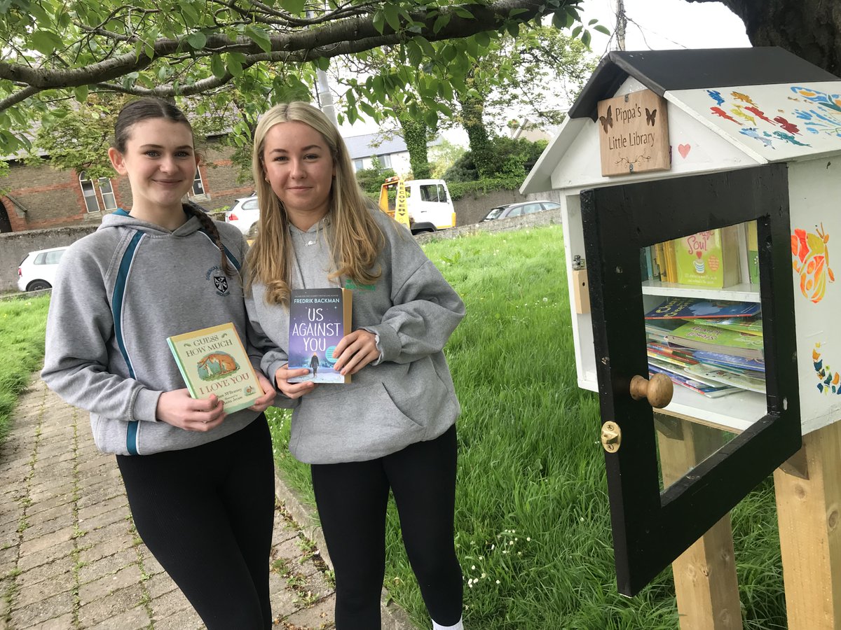 Mika and Mia, leaders of the TY #Wellread team adding books to one of
#Wicklow town’s mini libraries