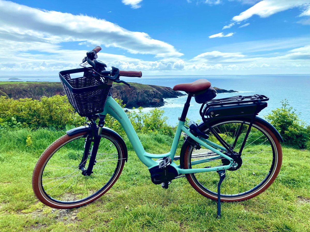 JamesParkin2010's tweet photo. I enjoyed taking one of the new @OrielyParc e-bikes out for a quick spin in the sunshine today. PCNPA is hoping to launch an e-bike hire scheme for #StDavids in readiness for the school summer holiday (watch this space). https://t.co/AsGLSaWoiM