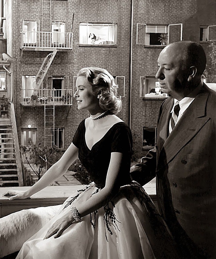Grace Kelly and Alfred Hitchcock on the set of the Rear Window, 1954