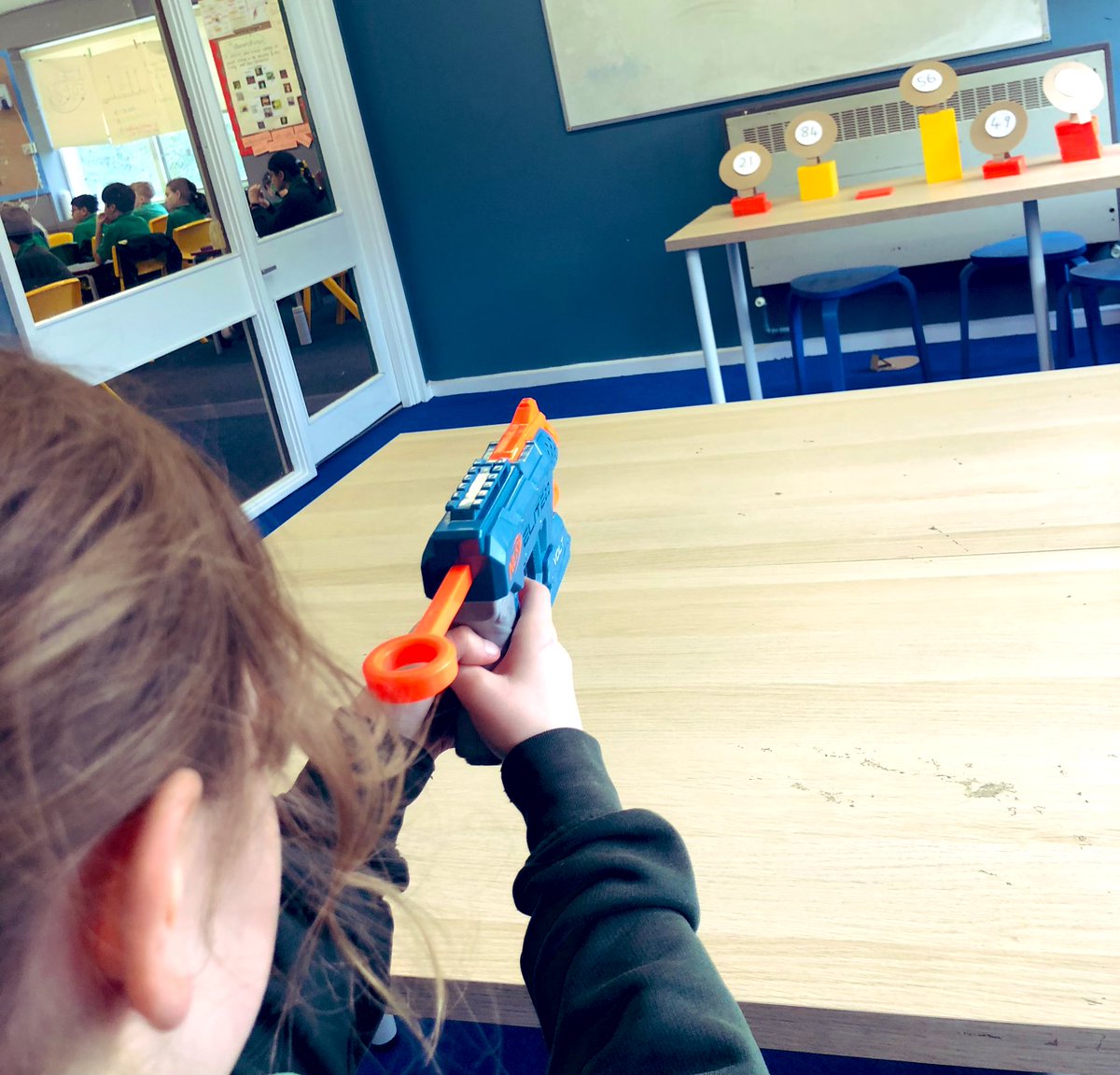 Ver_WPA's tweet image. Who said times tables are boring?! Ready, aim and solve the calculation! Today’s focus was the 7 times table #WatersideMaths #happychildrenlearn