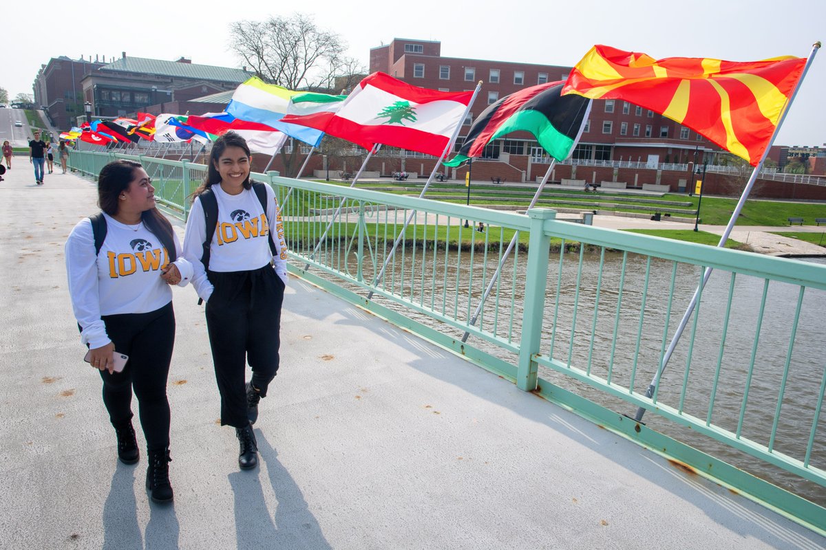 UIowaCPH's tweet photo. It's a beautiful day to check out the 2nd coolest new tradition @uiowa! The Bridging Our World display on the IMU footbridge features the flags of the countries represented by students attending the university. Find the location of individual flags at https://t.co/fCU2q9RkDH https://t.co/akyopX9Sk9