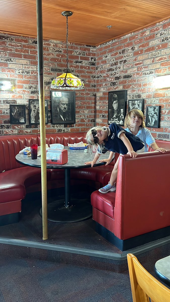 Fuddruckers on us1 has poles at their booths. Maybe it used to be a cabaret or people are pole dancing while eating their hamburgers….