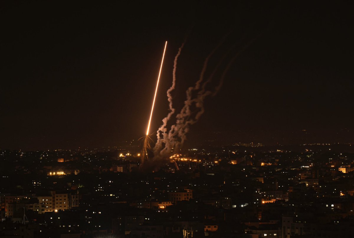 Palestinian militants fired hundreds of rockets from the Gaza Strip into Israel on Wednesday, while Israel pressed ahead with a series of airstrikes that have killed 21 Palestinians, including three senior militants and at least 10 civilians. (AP Photo/ Fatima Shbair)