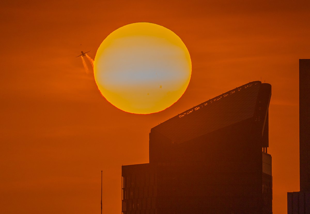 The smoke from the wildfires in Alberta, Canada, made their way to #Pittsburgh today, and after a hazy sunrise this morning they produced a spectacular sunset tonight. Even caught a plane flying by the sun, with the exhaust illuminated similar to what happens on a rocket launch.