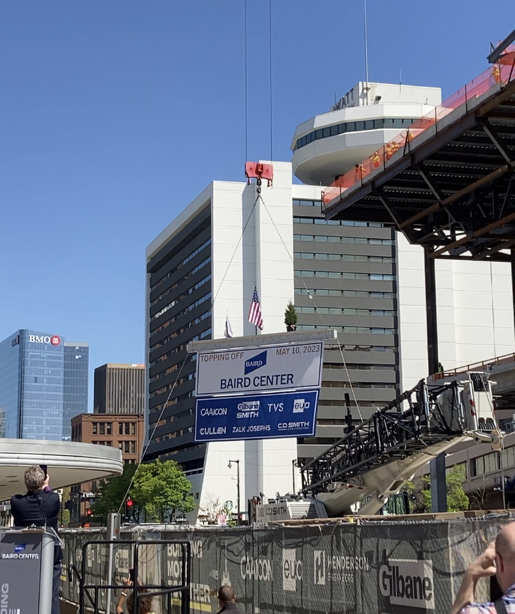 BairdCenter's tweet photo. What a day! Today the final piece of structural steel was lifted into place, completing the framing of the expanded Baird Center. Thank you to everyone who joined us this afternoon for the celebration. #BairdCenter #BuildingMore #BuildingMoreMilwaukee https://t.co/BQWlvNrRXM