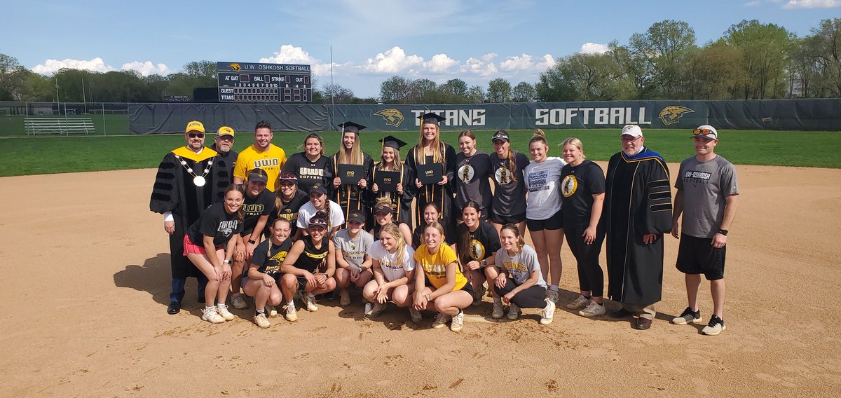 uwochancellor's tweet photo. The walk-up music today was effectively Pomp and Circumstance! Congratulations to spring @UWOSoftball1 &amp; @UWOBaseball grads. They can't make Saturday's @uwoshkosh Commencement due to games, so we brought a ceremony to their practice fields today. #uwograd @UWOshkoshTitans https://t.co/WRUQxY0NuH