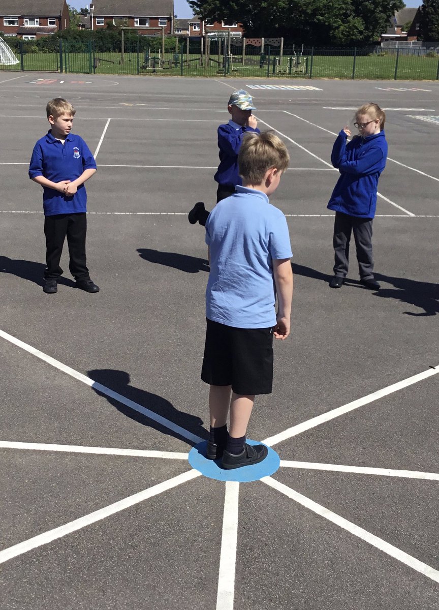 LeysFarm's tweet photo. Class 4W taking advantage of the sun yesterday when recalling turns and angles. They used the playground markings to work on compass points and directions. #LFJSMaths https://t.co/aYVx1b0GlL