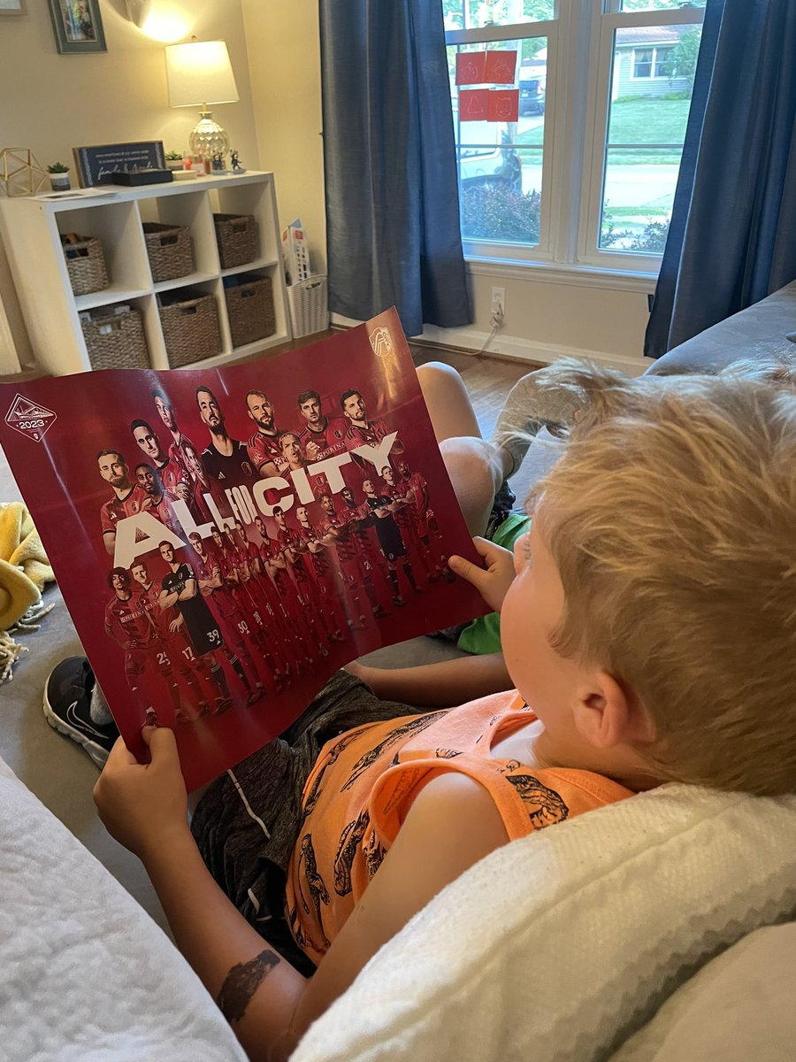JustinHenry14's tweet photo. Caught my son studying the @stlCITYsc team poster in attempt to memorize the players faces and kit numbers. #ItsInOurDNA #ProudDad #AllForCity https://t.co/eJCPv2YrMO