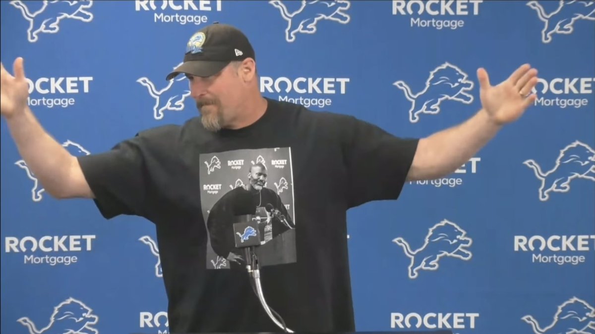 BSMotorCity's tweet image. Dan Campbell wearing a shirt of Brad Holmes wearing a shirt of Dan Campbell